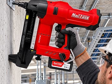 Electrician fixing to a concrete wall with the NailTask DCCN100X2 20V cordless concrete nailer