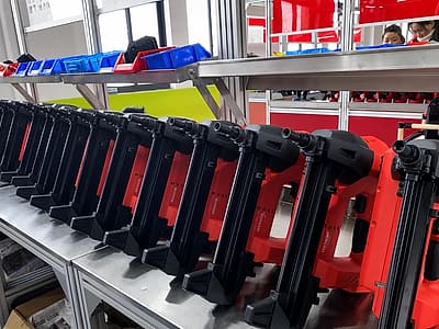 Final quality control line inspecting and firing-testing finished cordless concrete nailers
