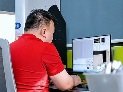 Incoming quality control inspector measuring raw material for nail gun components